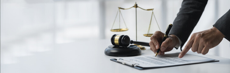 copy space, banner, panorama Lawyer or legal advisor reading and reviewing contract documents for...