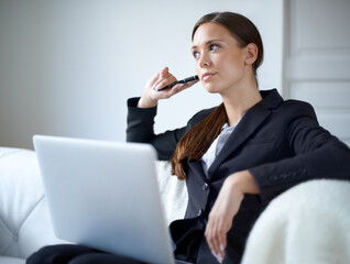 Business woman, sofa and laptop for thinking with mindset, memory or idea for vision in home...