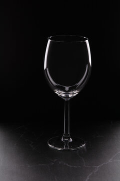 photo one empty glass on a dark background