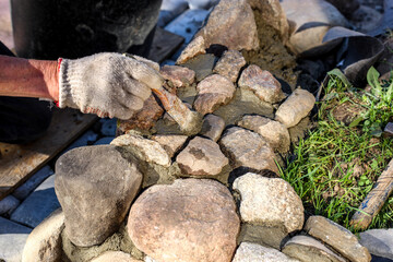 Hands of an old master mason