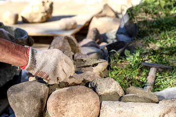 Hands of an old master mason