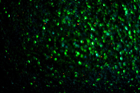 Abstract glitter sparkle explosion background for celebrations. Light fireworks. Abstract bokeh background. Christmas, birthday holiday blurred abstract design. Glitter texture, abstract background.