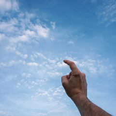 hand up gesturing in the blue sky, feelings and emotions