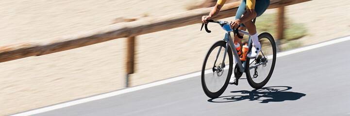 Fototapeta na wymiar Road bike cyclist man cycling, athlete on a race cycle. Panning technique used