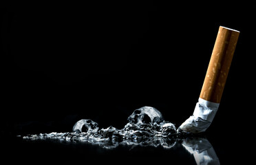 Cigarette ashes with skull.Tobacco cigarette butt on black background.World No Tobacco Day Concept Stop Smoking. © witsarut
