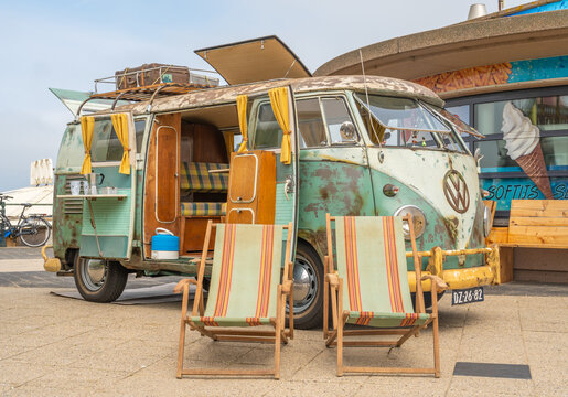 Scheveningen, The Netherlands, 14.05.2023, Retro Volkswagen microbus camper van from 1962 with beach chairs displayed at The Aircooled classic car show