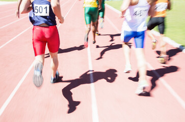 Fototapeta na wymiar Runners racing on track