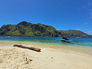 Fototapeta premium traditional wooden outrigger boats on palawan island