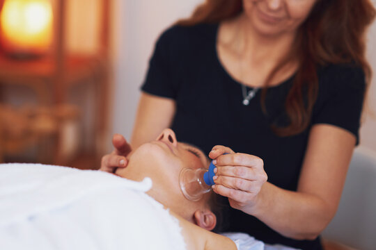 Woman having a face cupping massage in salon