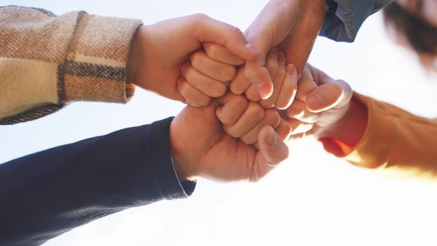 business teamwork. fist crowd group people. business team work together concept. a group of people put their fist together teamwork. team union concept. a group put their fists together close-up
