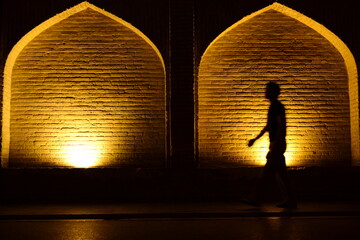 Khaju Bridge in Isfahan lit up at dusk in Iran