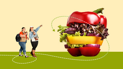 Overweight women looking at giant burger made of papers, lettuce. Following healthy dieting to lose...