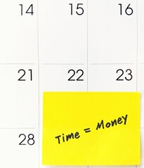 Calendar with note written TIME IS MONEY , meaning time is precious for those who want to earn...