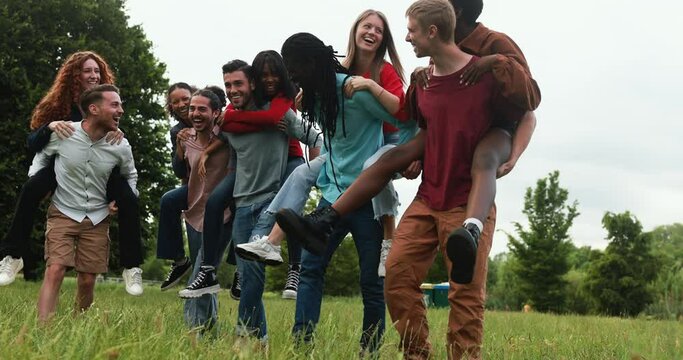 Young multiracial friends having fun outdoor laughing together 