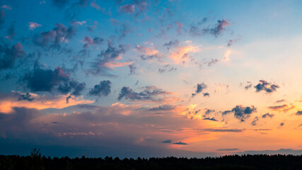 Natural sunrise over forest. Bright red sky. Countryside landscape. Under scenic colorful sky at sunrise.