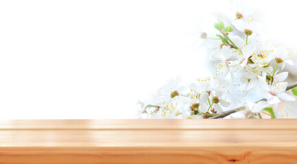 Empty wooden table for product demonstration and presentation against the backdrop of spring...