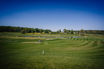 Fototapeta premium Golf course in spring in sunny weather