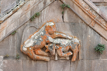 Fight of a lion and a bull. Detail of decoration of Surb Hovannes church. Tsakhats Kar monastery, Vayots Dzor Province, Armenia.