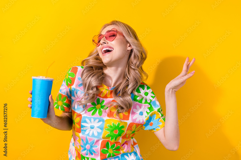 Sticker Photo cute dancing lady drink nonalcoholic beverage youth party wear heart sunglass print shirt isolated yellow color background