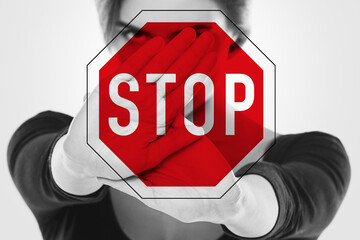 Angry woman and stop sign. Women's rights - stop discrimination, harassment and violence against...