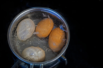 boil eggs in a saucepan on the stove. egg cooking healthy eating concept, flatlay