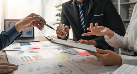 Business people discuss investment project working and planning strategy on digital tablet....