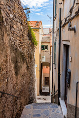 Narrow Italian street in Porto Venere in Italy - obrazy, fototapety, plakaty
