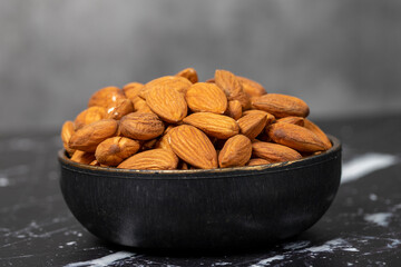 Almond. Organic almond nut in bowl. Superfood, Vegetarian food concept. healthy snacks. Close up.