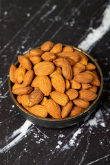 Almond. Organic almond nut in bowl. Superfood, Vegetarian food concept. healthy snacks. Close up.