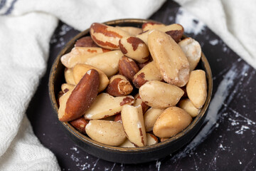 Brazil nut. Brazil nut in wooden bowl. Superfood. Vegetarian food concept. healthy snacks