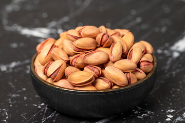Pistachio nut. Pistachio in shell in bowl. Superfood. Vegetarian food concept. Healthy snacks