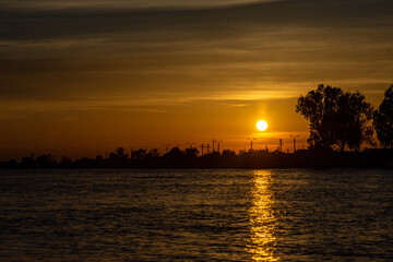 Fototapeta premium sunset over danube river, near sulina, romania