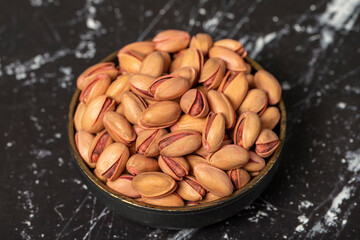 Pistachio nut. Pistachio in shell in bowl. Superfood. Vegetarian food concept. Healthy snacks