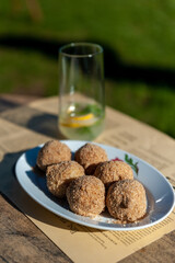 sweet plum dumplings with a glass of lemonade aside