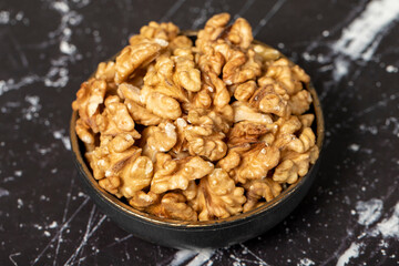 Walnut. Walnut kernel in bowl. Superfood. Vegetarian food concept. Healthy snacks. Close up