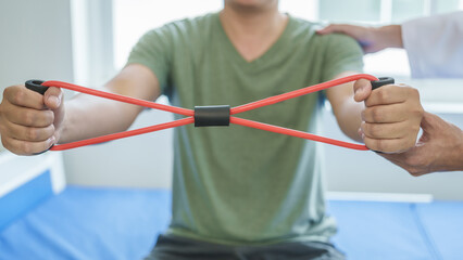 Professional massage therapist physiotherapy worker rehabilitation physiotherapy man at work with patient man client at clinic