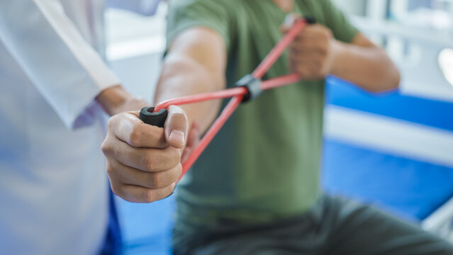 Professional massage therapist physiotherapy worker rehabilitation physiotherapy man at work with patient man client at clinic