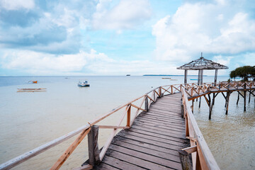 Beautiful landscape. Wooden bridge on the beach, Siargao Island, Philippines.