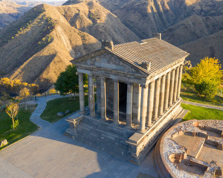 Aerial view of Garni temple without tourists on sunny autumn evening. Garni village, Armenia.