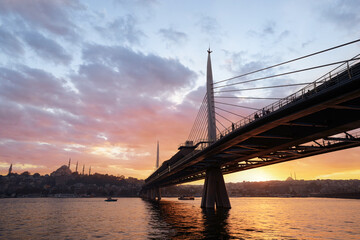 Fototapeta na wymiar Halic Metro Bridge in Istanbul. Modern cable bridge. Beautiful sunset view on Golden Horn.