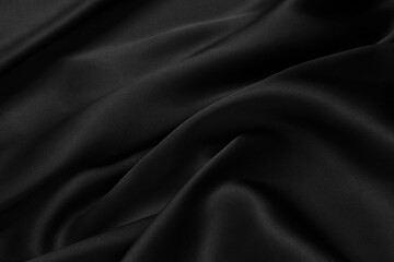Part of the dark fabric texture of the fabric for the background and decoration of the work of art, a beautiful crumpled pattern of silk or linen. A crumpled piece of cloth