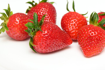fresh juicy appetizing strawberries on a white background isolate studio shooting 2