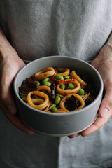 Asian noodles with squid and vegetables
