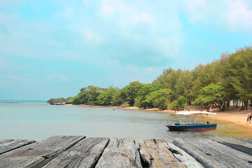 Wooden pier, wooden table on the beach in Thailand. 