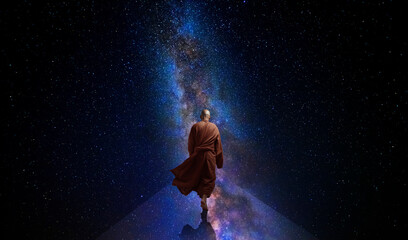 Obraz premium Buddhist monk looking at the universe. AI generative