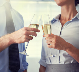 Closeup of business people, champagne and toast for celebration, staff party and event. Hands of man, woman and employees cheers with wine, drinking alcohol and glass to celebrate winning teamwork