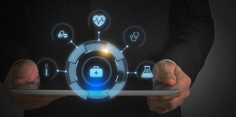 Doctor holding electronic medical icons on tablet, hospitals, medication and health image