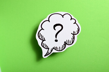 drawn question mark on a green background