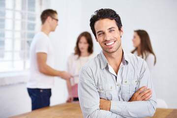 Portrait, happy and business man with arms crossed in office, workplace or company. Face, smile and confident male professional, entrepreneur or person with pride for career, job and success mindset