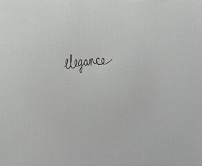 "Elegance" written on white paper